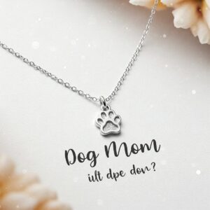 Close-up illustration of a delicate silver necklace with a paw print charm, a beautiful dog mom gift.