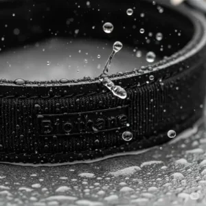 Close-up of a waterproof Biothane dog collar repelling water droplets, highlighting its quick-dry properties.